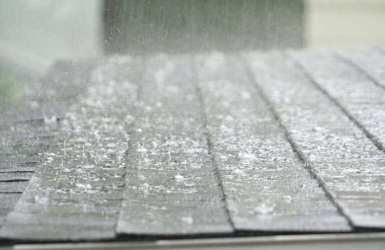 What are the signs of hail damage on a roof?